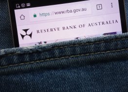 RBA website on a smartphone peeking through jeans pocket
