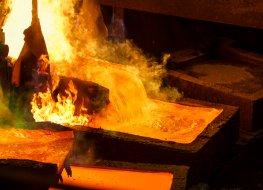 Molten copper metal is poured into a mould at a copper plant