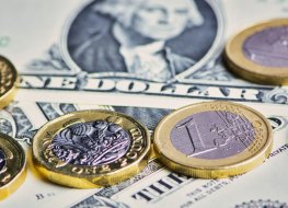 British Pound, Euro coins and US Dollar banknotes 