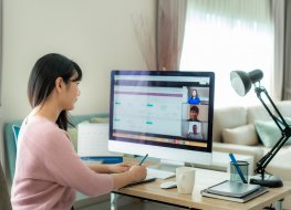 A remote worker working at her desk at home
