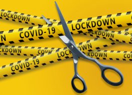 Scissors cut yellow ribbons with text Covid-19 lockdown