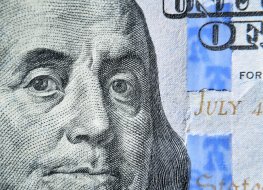 A $100 bill with picture of Ben Franklin