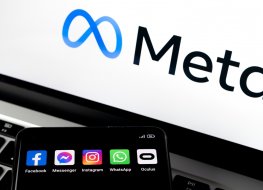 Silhouette of smartphone with Facebook, Messenger, WhatsApp, Instagram, Oculus apps and Meta logo in the background