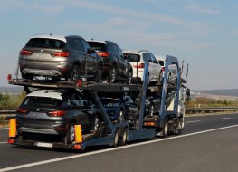 File photo of a truck carrying new BMW cars on a motorway